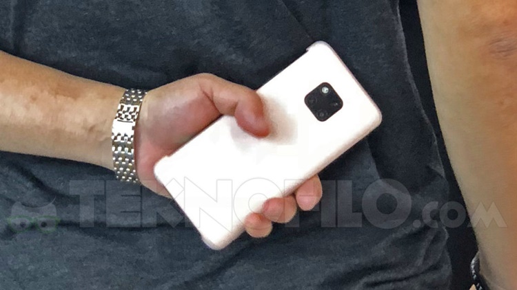 A Huawei Mate 20 smartphone spotted in public revealing a boxed-shaped triple rear camera + some leaked tech-specs